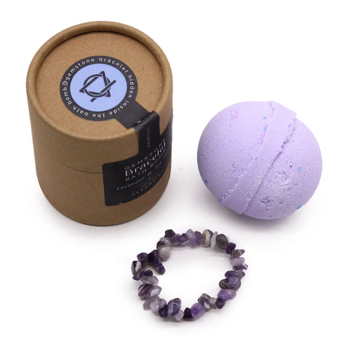Lavender bath bomb, gemstone chip bracelet, and eco-friendly brown gift box on white background